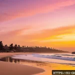 Home 20 가나에서 꼭 가봐야 할 관광지 - A tranquil sunrise scene at Bondi Beach in Ghana, featuring soft golden sand stretching along a calm...
